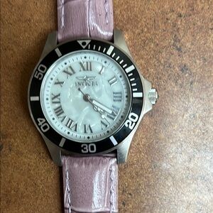 Invicta Black and Lilac Timepiece. NWOT. Runs.Glow in the dark hands.Never worn